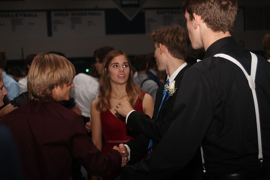 Junior Ellie Boone looks at junior Ben Wieland during a conversation.