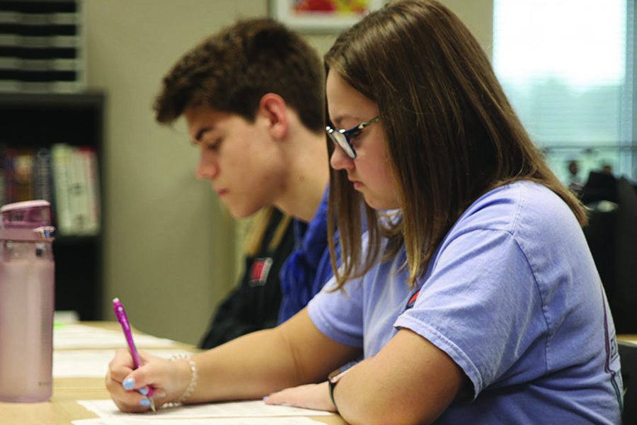 Taking a practice test in Jeff Wieland’s ACT Prep class, junior Chloe Carr prepares for her standardized ACT test, which may replace the current Kansas State Assessment in upcoming years.