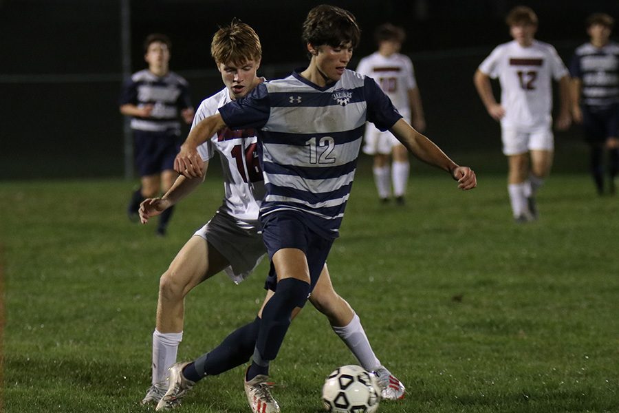 Senior Anthony Pentola blocks the other team’s player from getting to the ball.