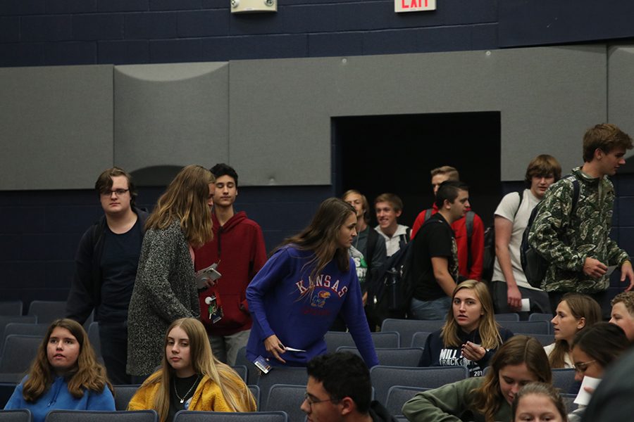 Students load into the little theatre and find a place to sit before the Film Fest begins.