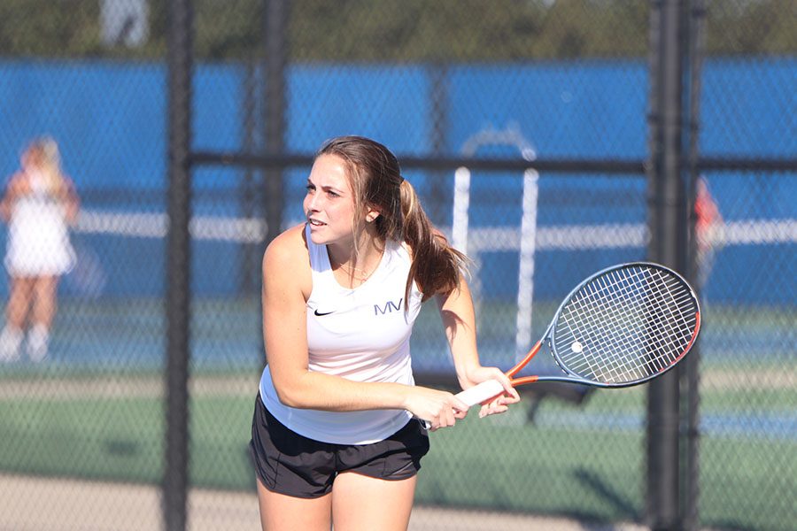 Junior Sophie Lecuru waits to hit the ball back at her opponent. 