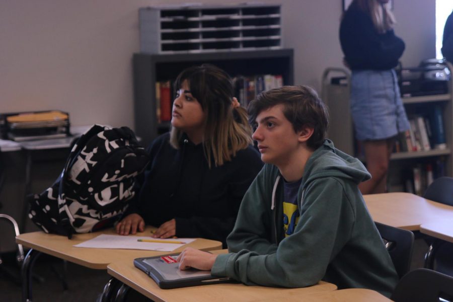 During the GSA meeting on Tuesday, Oct. 9, freshmen Kimberly Ornelas Garcia and Noah Basso use laptops to plan ideas for posters. 