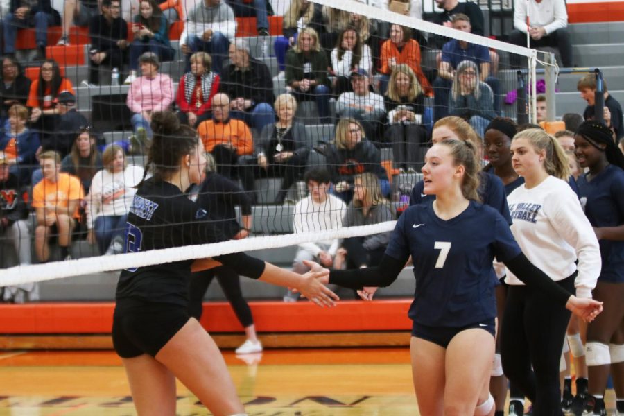 After the Jags win their third set against Olathe Northwest and advance to the next round of substate, the two teams meet at the net in a show of good sportsmanship. 
