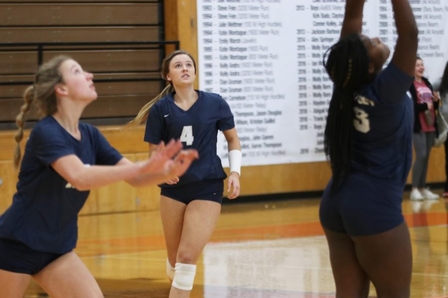 Eyes on the ball, senior Emma Fox runs forward to assist her teammates. 
