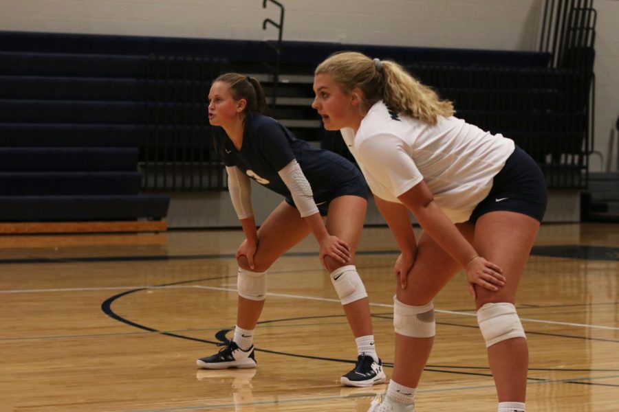 Focused on the other side of the court, juniors Landry Haydock and Jaden Ravnsborg stand in anticipation. 