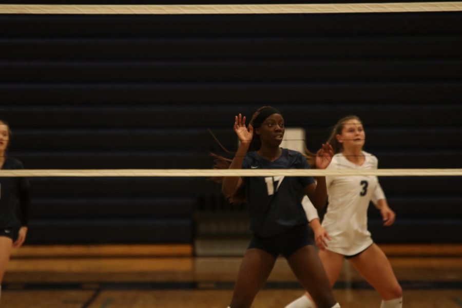 Hands up, senior Faith Archibong waits for the ball to come over the net.