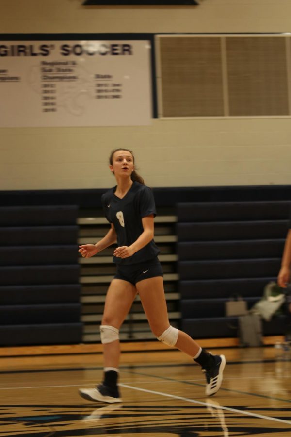 Concentrating on the ball, sophomore Amara Traiger jogs back to her place after running for the ball. The team competed in a dual at home against Gardner Edgerton on Tuesday, Oct 22. They beat Gardner Edgerton 3-2.