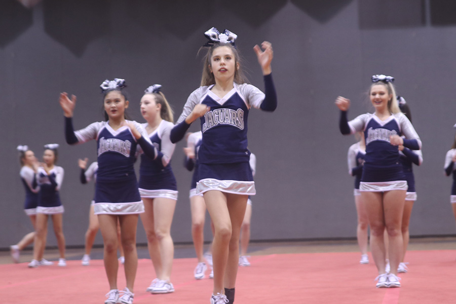 Doing her best, freshmen Sidney Claeys gives it her all in performance by yelling out the chant.