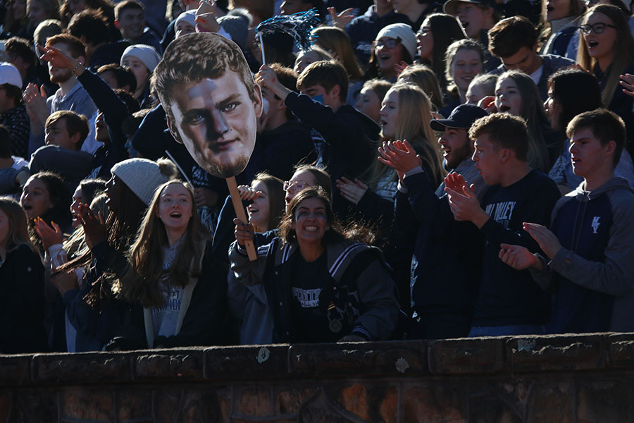 Waving a big head, senior Jessica Garcia shows support for senior Kyle Kelly. 