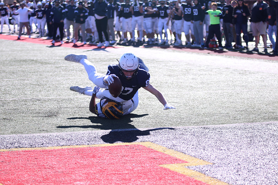 Leaping through the air, sophomore Jared Napoli tries for a touchdown. 
