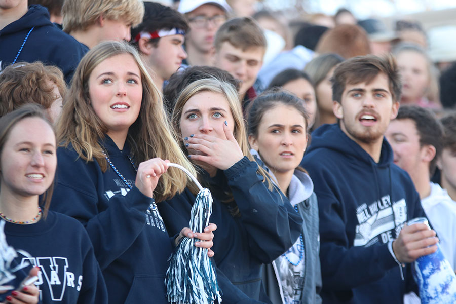 With a distressed look on her face, senior Mallory Scheelk peers towards the scoreboard. 
