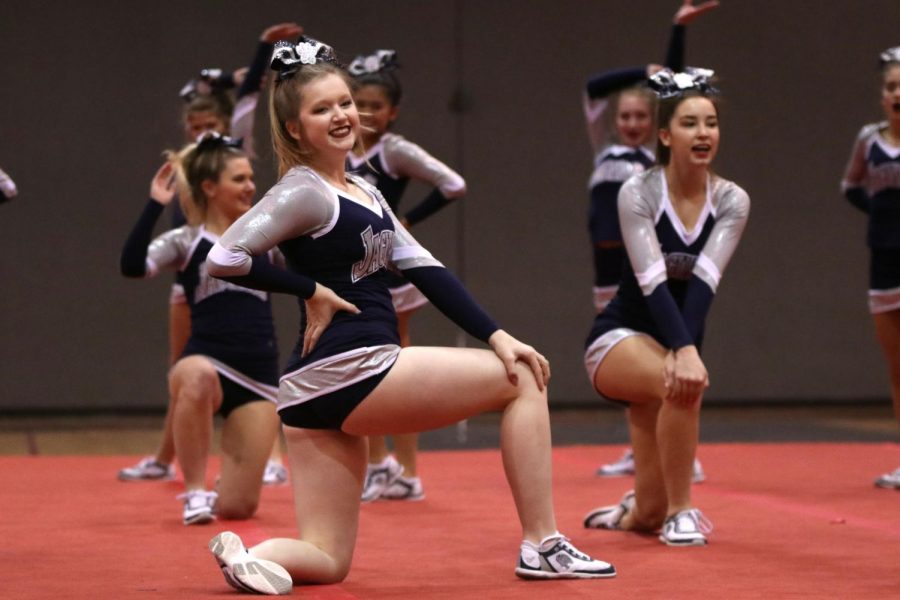 Striking a pose, senior Sara Petropoulos finishes the routine strongly.