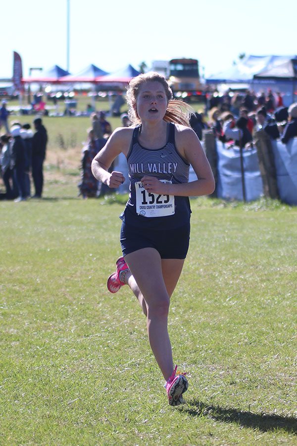 Putting in one final push, senior Jenna Walker sprints to the finish line.