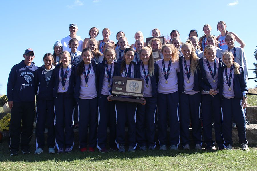 The girls accept the 6A state trophy during team awards. 