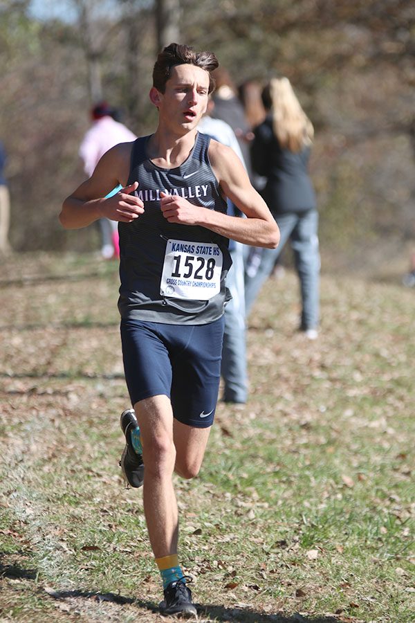 Approaching the bridge, senior Darius Hightower begins his last mile before finishing fifth. 