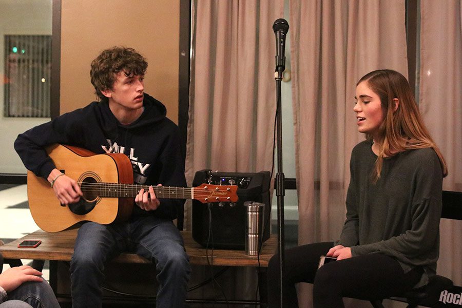 As one of the early performers at the Open Mic Night, juniors John Fraka and Ellie Boone perform the song “Valerie” by Amy Winehouse Tuesday, Nov. 12.
