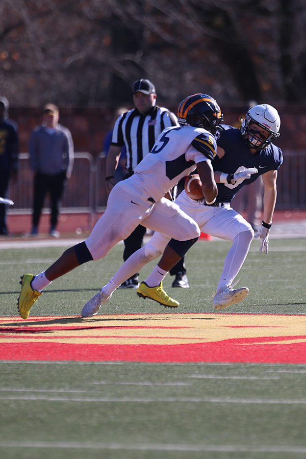 Trying to block Wichita NW offender, senior Kendal Christopher runs after the opposing player before they score a touchdown.