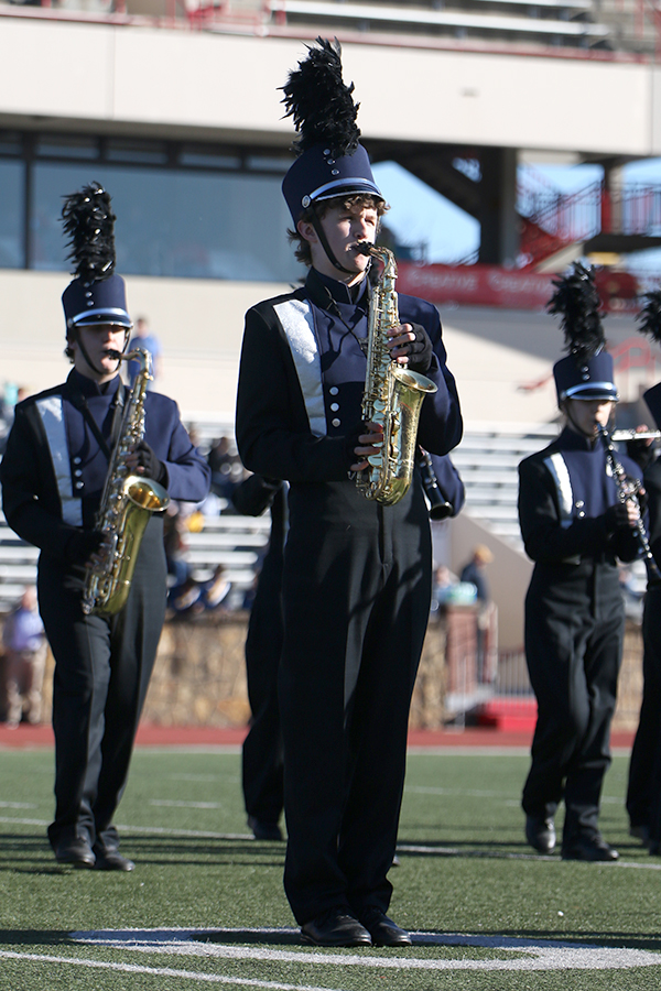 During the band half-time performance, junior John Fraka plays the Saxophone. 