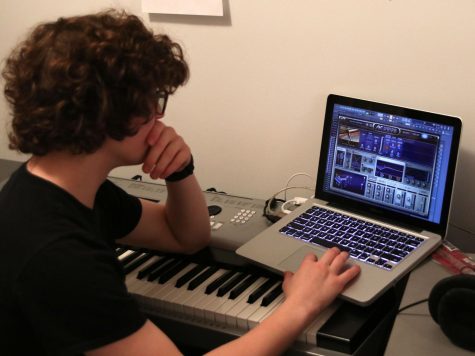 Using his personal computer, Jon Pursell works on creating his own music on a daily basis.