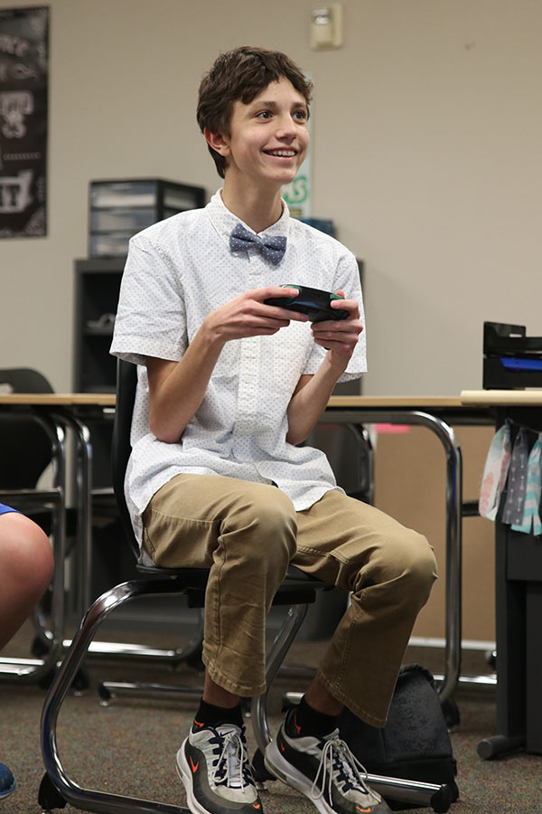 Smiling, freshman Jackson Wilhoit celebrates winning his round.
