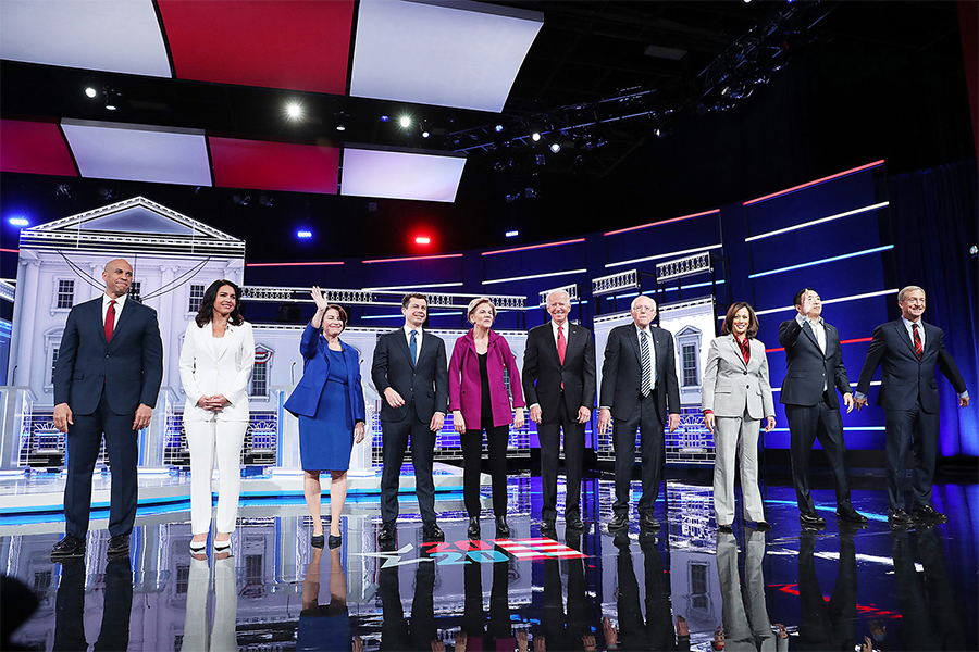 Democratic presidential candidates, from left, Sen. Cory Booker, Rep. Tulsi Gabbard, Sen. Amy Klobuchar , South Bend, Ind., Mayor Pete Buttigieg, Sen. Elizabeth Warren, former Vice President Joe Biden, Sen. Bernie Sanders, Sen. Kamala Harris, former tech executive Andrew Yang, and billionaire Tom Steyer come on stage before the start of the fifth Democratic Presidential Debate on Wednesday, Nov. 20.