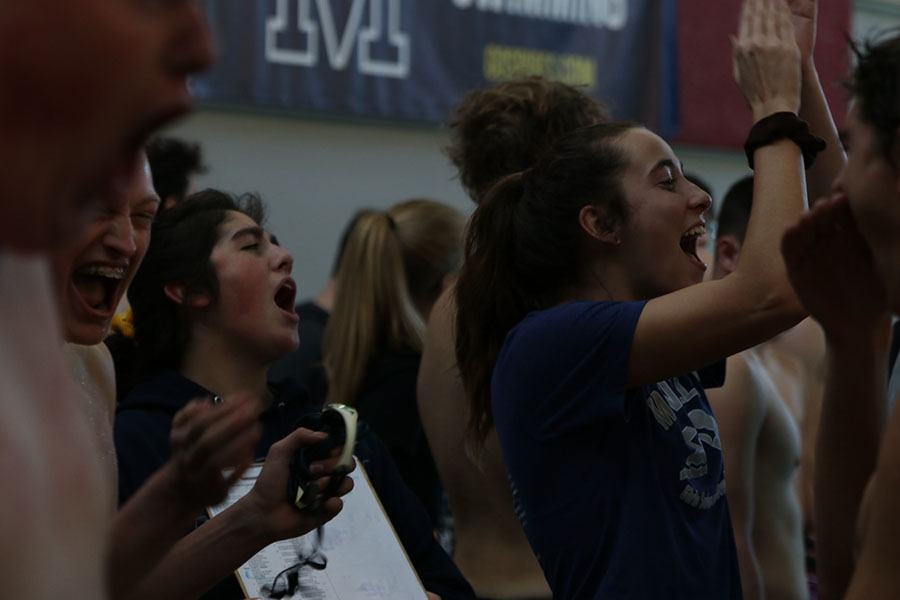 Yelling for their team, managers Aaliyah Gonzalez and Mckenzie White cheer for their fourth place victory.