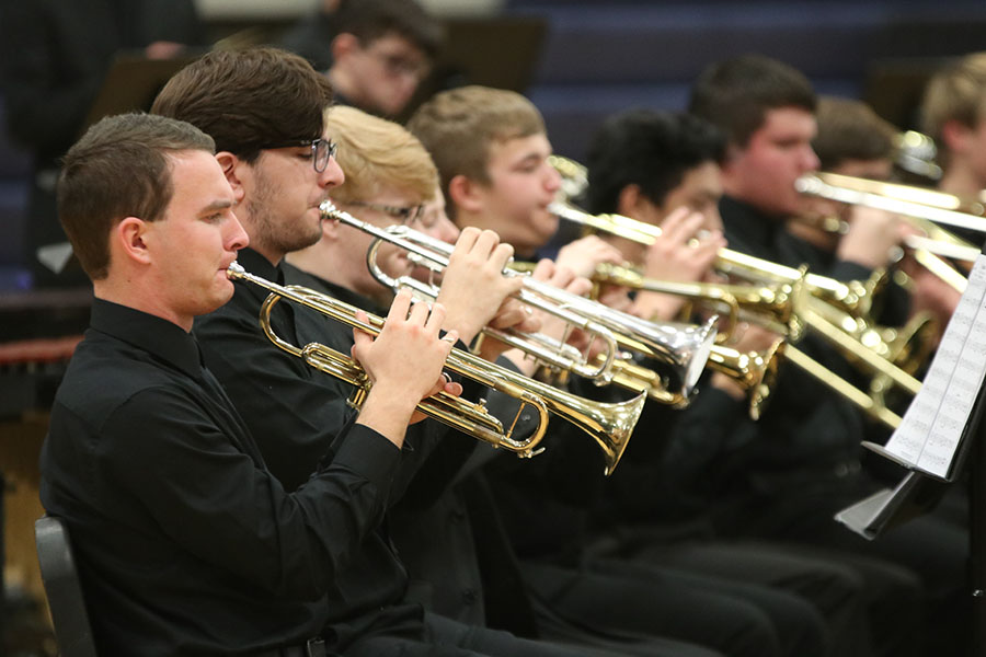 At the winter concert Wednesday, Dec. 4, senior Sam Greenup plays Sunburst on his trumpet.