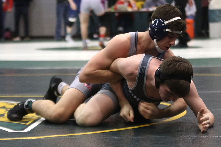 With his opponent’s arm forced back, junior Nick Whisler plans his next move.