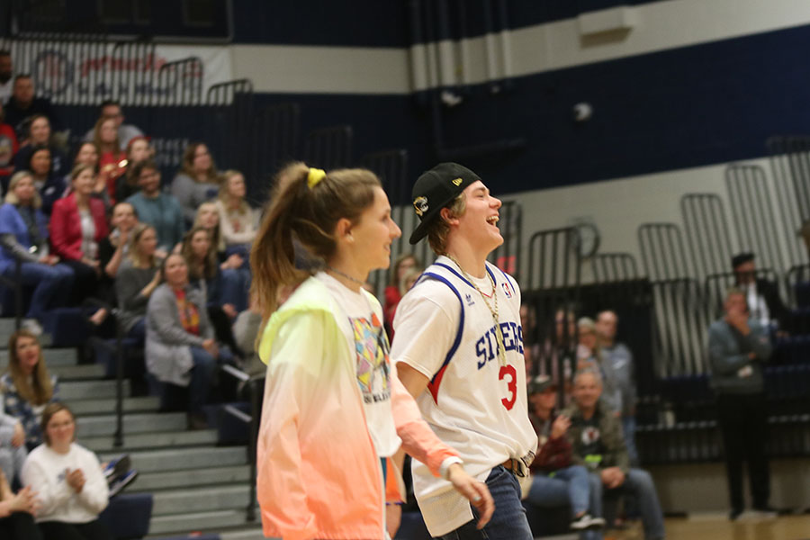 Smiling while they enter, third place winners senior Morgan Koca and senior Grant Frost are ready to show off their dance. 