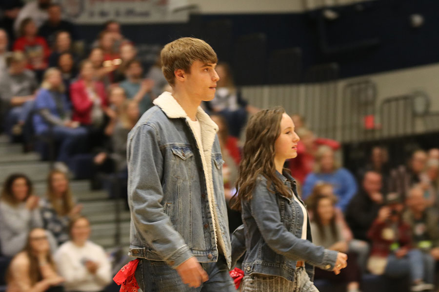 Entering the gym floor, first place winners seniors Rylee McElroy and Josh Glunt walk to the middle of the gym.