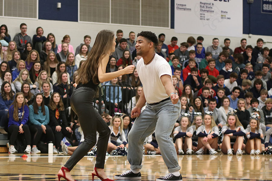 Dancing in the middle of the gym, second place winners seniors Abby Miller and senior Tyler Green show off their moves. 