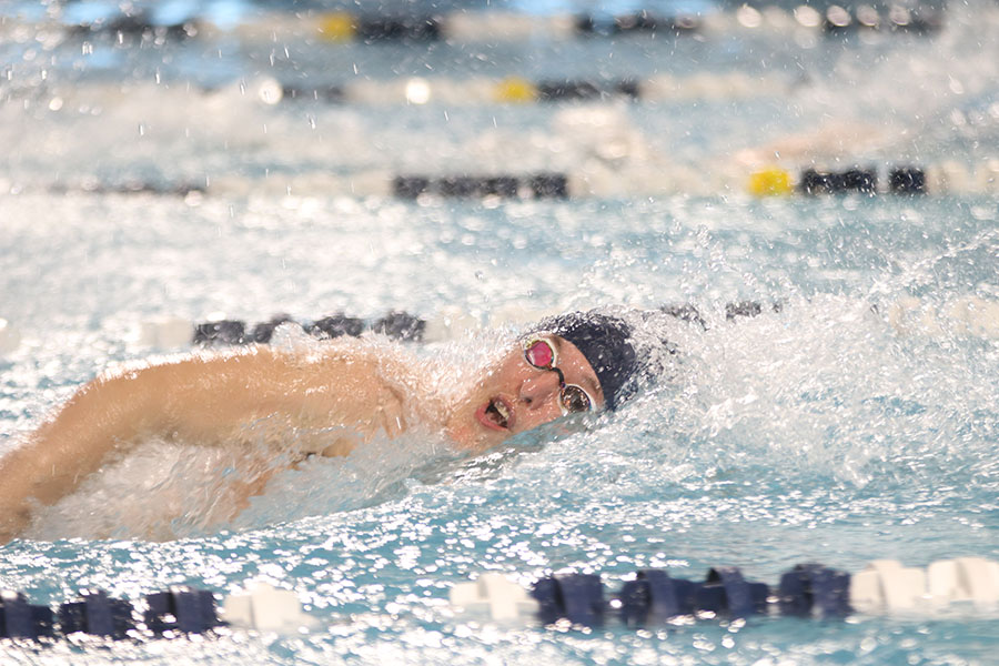 Swimming freestyle in the 200-yard medley relay, senior Colby Beggs completes the relay for his team.
