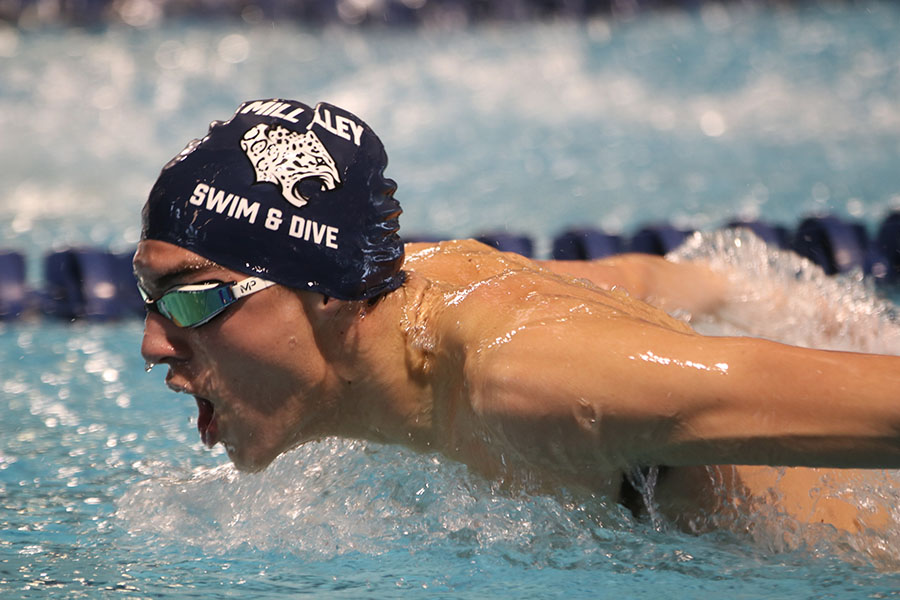 Competing in the 200-yard IM, junior Cole McClure swims butterfly down the lane. The boys swim team placed eighth overall at the Shawnee Mission Invite Saturday, Jan. 25.
