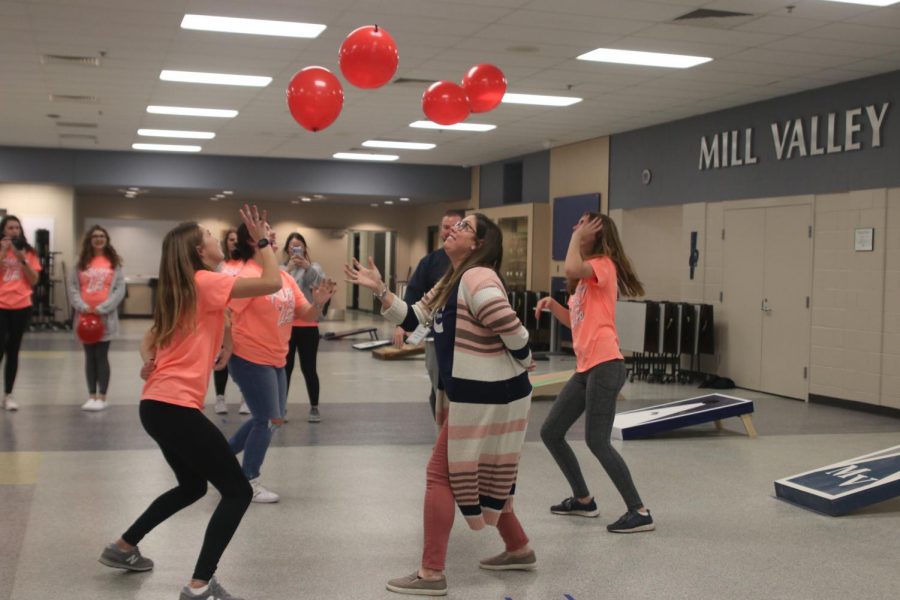 To help break ties and eliminate competitors in the tournament, teams played a new game. The participants had to hold one hand behind their back while trying to keep balloons in the air between them and their partner. The tournament was held Wednesday, Jan. 29 by the Relay for Life committee. The event was held to help raise money and get the word out about the upcoming event Relay for Life. 