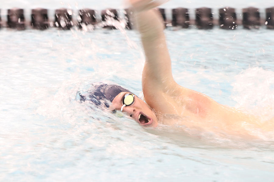 Catching his breath, junior Noah Collins swims in the 200-yard IM, placing fourth with a time of 2:24.15.