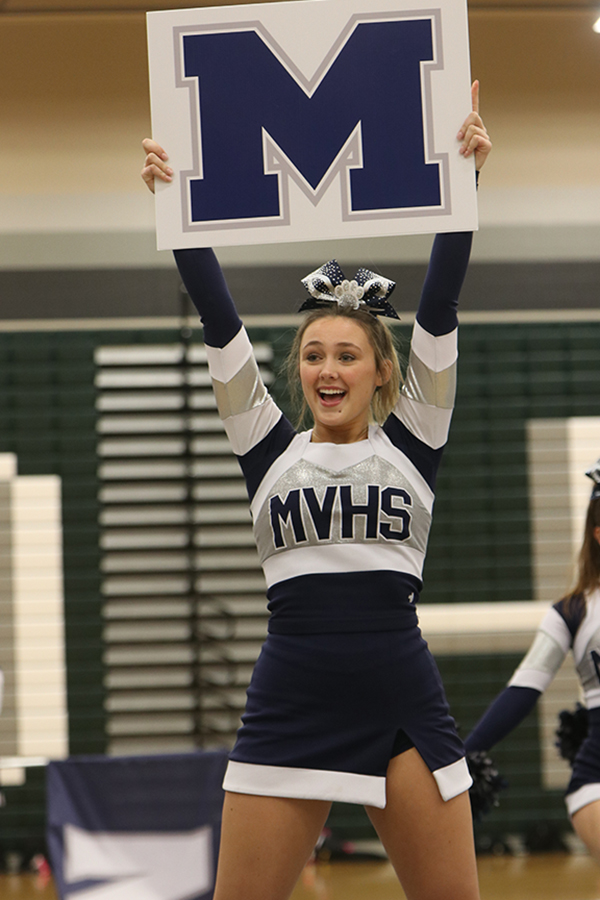 Smiling out to the audience, senior Audrey Grabmeier holds up the “M” for MVHS up in the air for everyone to see.