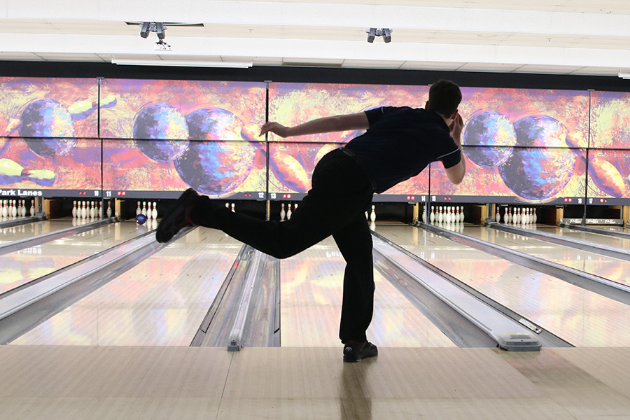 Launching the ball, junior Jackson Perry bowls another strike. 