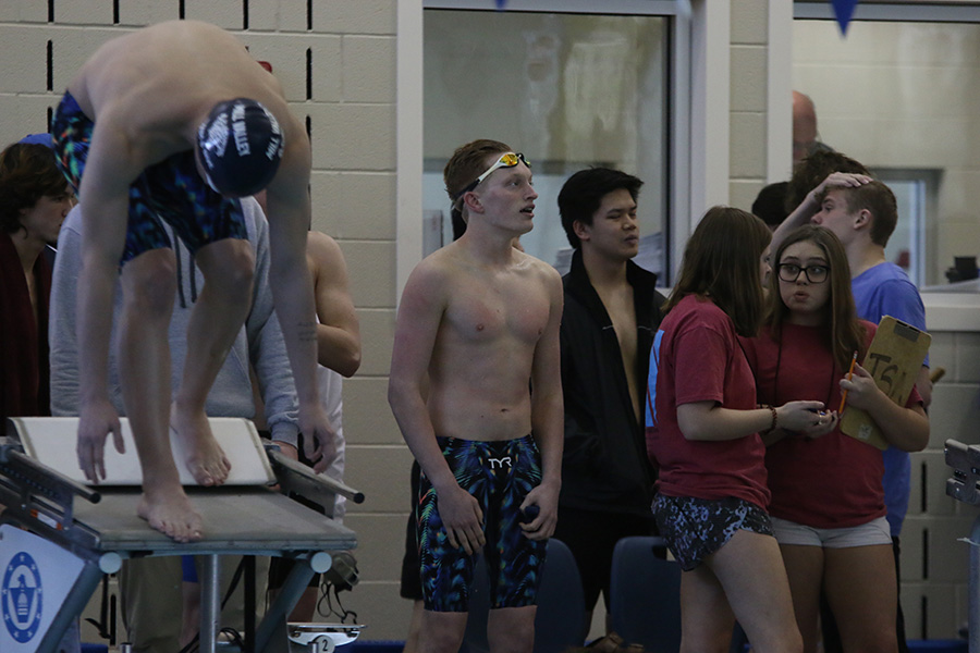 After finishing the 50-yard freestyle, freshman Anthony Molinaro looks at the scoreboard to see how he did. He placed 8th overall in the event.