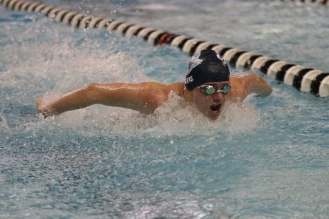 Coming up for air, junior Mason Davis swims in the EKL Finals Saturday, Feb. 8 after competing in EKL Prelims Friday, Feb. 7.