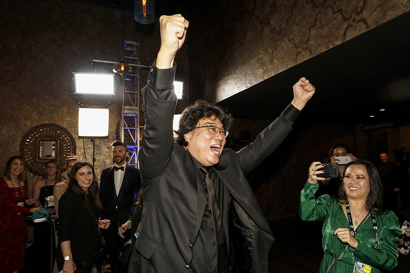 Parasite director Bong Joon Ho cheers his casts landmark win, marking the first time in history that a foreign-language film has won the SAG Award for best ensemble.