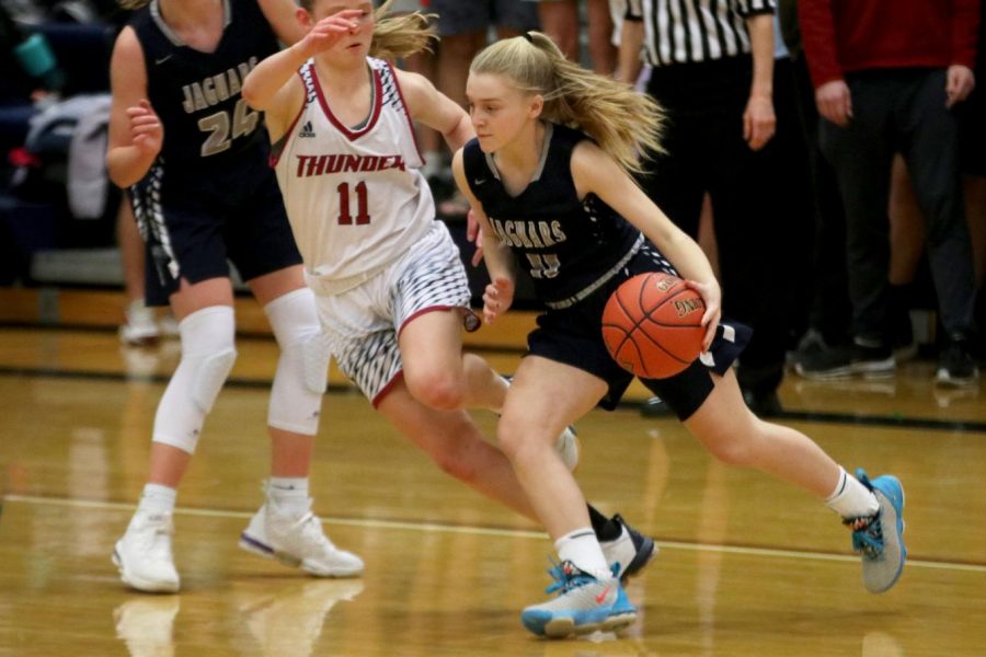 Dribbling the ball, freshman Sophie Pringle runs past an opponent. The team lost to St. James 60-30 on Friday, Feb. 7.