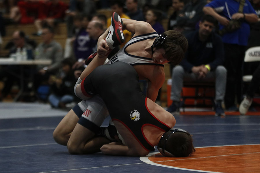 On the verge of breaking his opponent, freshman Eddie Hughart takes control of the match at regionals Saturday, Feb. 22.