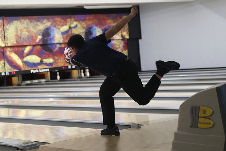 Releasing the ball, junior Devin Kuhlman prepares for a strike.