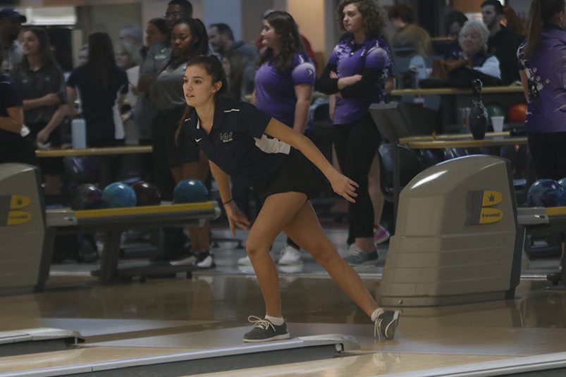 Watching intently, junior Payton Wagner waits for the ball to knock over the pins.