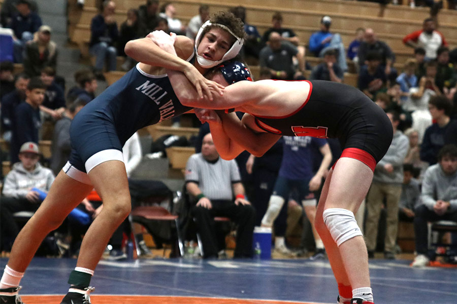 During the regional tournament on Saturday, Feb. 22, senior Zach Keal wrestles with his opponent. Keal went on to take first place in the 132-pound weight class.