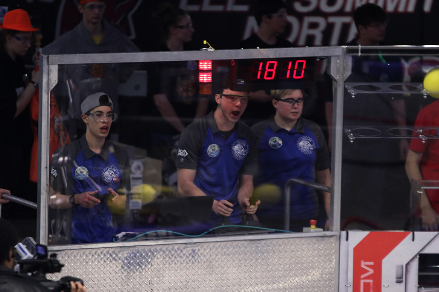 During the 21st match, the drive team shouts their final plans for the last minute of the game. 