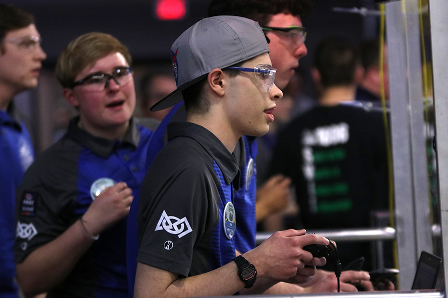 On Saturday, Feb. 29, the Jaguar Robotics Team participated at the Greater Kansas City Regional at Lee’s Summit North High school. With team members by his side cheering him on, junior Alex Whipple tries to get their robot in the final hanging position with only a few seconds to spare. 