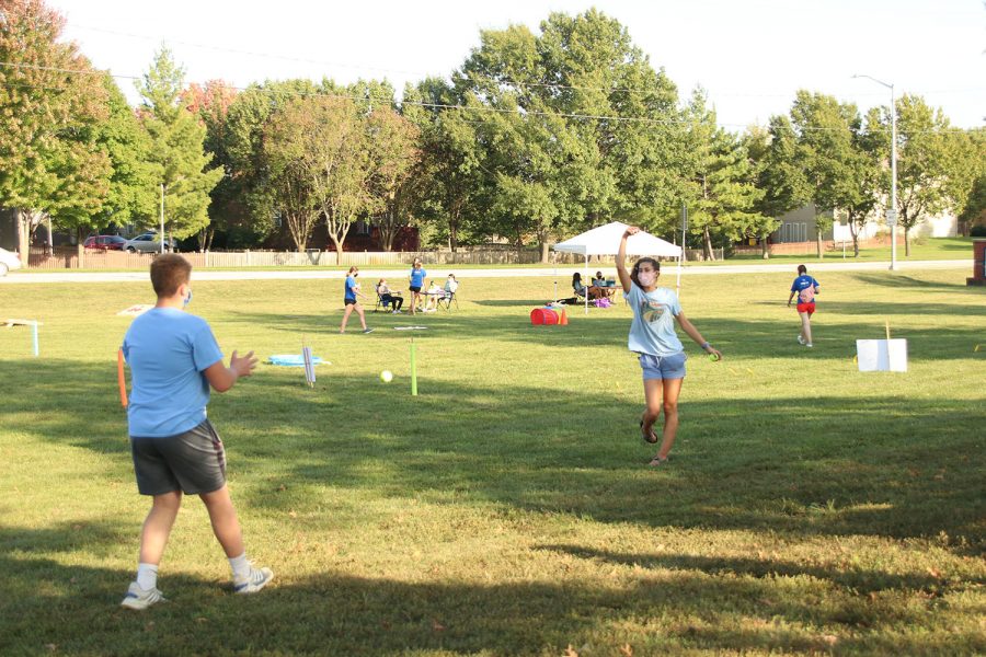 Playing catch, junior Declan Taylor and senior Nicole Crist wait for Bark For Life to start.