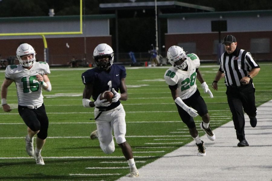 Running back Quin Wittenauer steps out of bounds at the end of a 30-yard carry. 