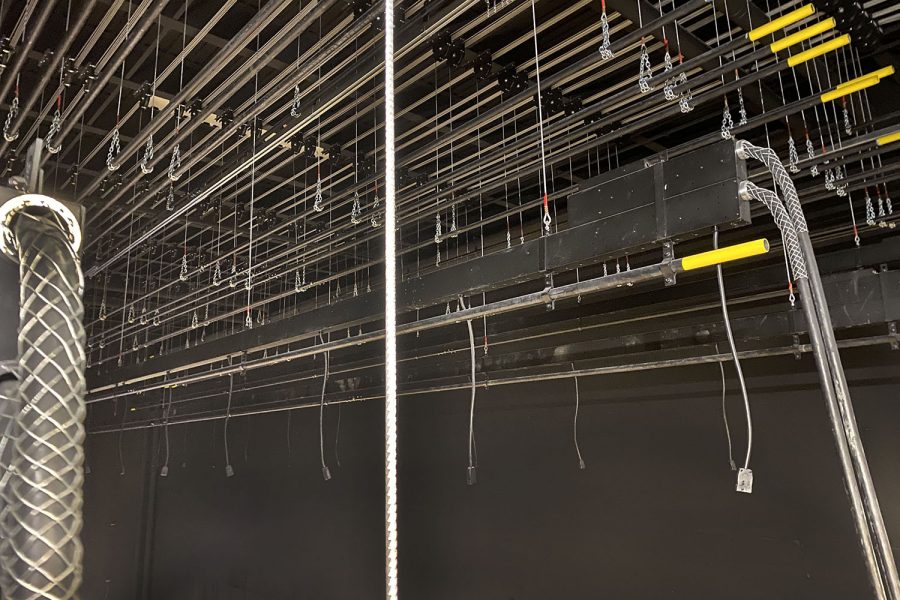 Behind the curtains, one can see all the pulleys that allow the theater team have more curtain options.   